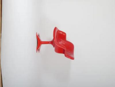 Two Yrjo Kukkapur red leather Junior chairs by Hami Finland c1960 
