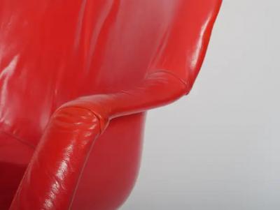 Two Yrjo Kukkapur red leather Junior chairs by Hami Finland c1960 