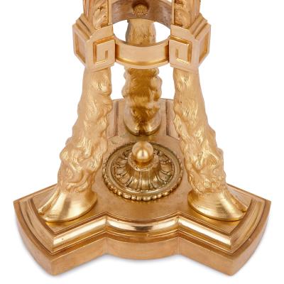 Two antique Neoclassical style gilt bronze tripod stands