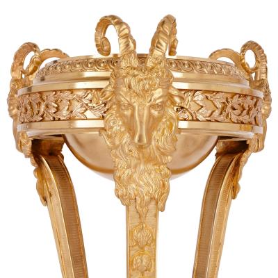 Two antique Neoclassical style gilt bronze tripod stands