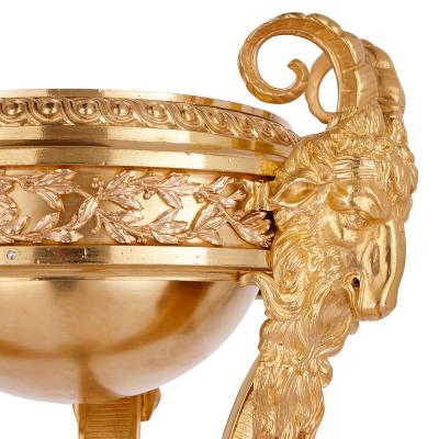 Two antique Neoclassical style gilt bronze tripod stands