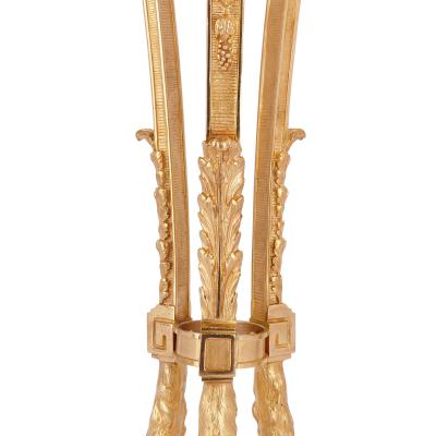 Two antique Neoclassical style gilt bronze tripod stands