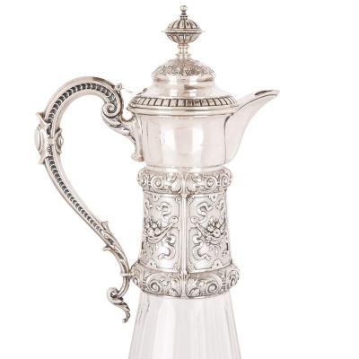 Two cut glass and silver claret jugs 19th Century