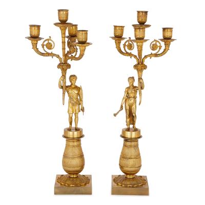 Two early 19th Century French Empire gilt bronze candelabra