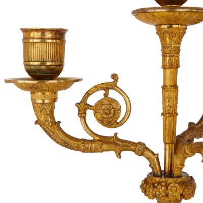 Two early 19th Century French Empire gilt bronze candelabra
