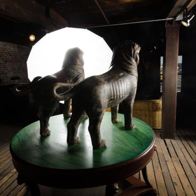 Two large life sized polychromed lion head wooden statues 