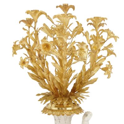 Two monumental biscuit porcelain and gilt bronze candelabra