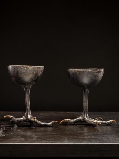 Two wooden witchcups mounted on birdlegs