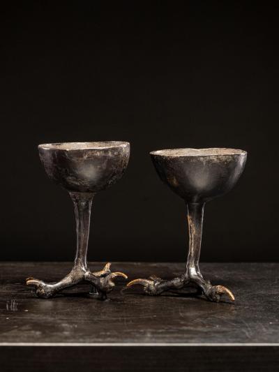 Two wooden witchcups mounted on birdlegs