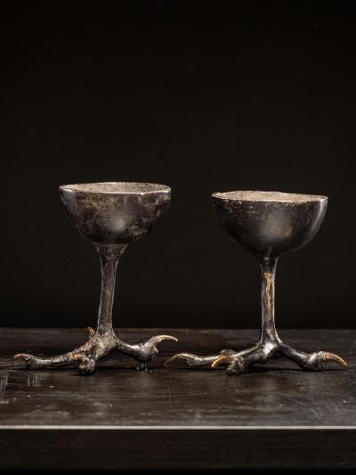 Two wooden witchcups mounted on birdlegs