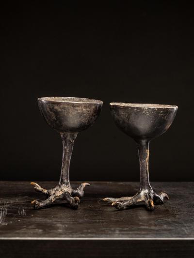 Two wooden witchcups mounted on birdlegs