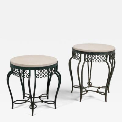 Two wrought iron side tables with replacement stone tops