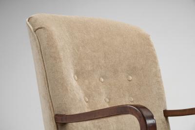 Upholstered Lounge Chairs with Sculptural Arms Europe ca 1940s