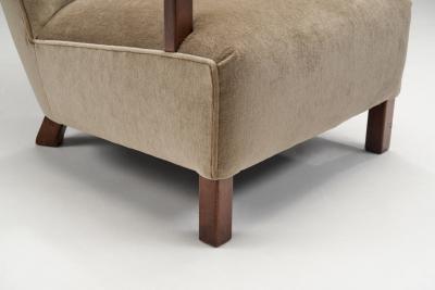 Upholstered Lounge Chairs with Sculptural Arms Europe ca 1940s