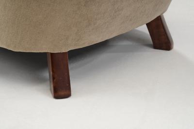 Upholstered Lounge Chairs with Sculptural Arms Europe ca 1940s