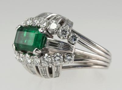 VINTAGE 1950S EMERALD AND DIAMOND BOMBE PLATINUM COCKTAIL RING