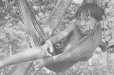 Valdir Cruz Yanomami Girl Playing in a Hammock