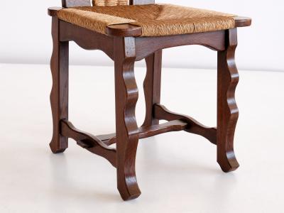 Victor Courtray Set of Six Victor Courtray Attributed Dining Chairs in Oak and Rush 1950s