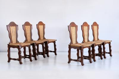 Victor Courtray Set of Six Victor Courtray Attributed Dining Chairs in Oak and Rush 1950s