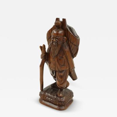 Vintage Asian Carved Figure of a Man with Pack and Walking Stick