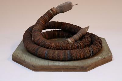 Vintage Folk Art Hand Carved Wood and Bottlecap Snake on Octagonal Base
