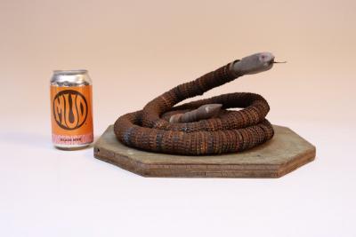 Vintage Folk Art Hand Carved Wood and Bottlecap Snake on Octagonal Base