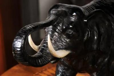 Vintage Italian Black Glazed Ceramic Sculpture of a Walking Elephant Trunk Up
