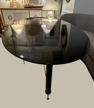 Vintage Italian Oval Ebonized Dining Table resting on a Bronze Base