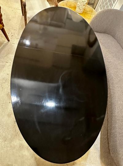 Vintage Italian Oval Ebonized Dining Table resting on a Bronze Base