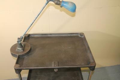 Vintage metal industrial work table with OC white lamp attached