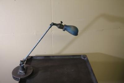 Vintage metal industrial work table with OC white lamp attached