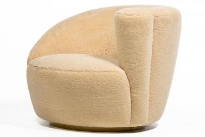 Vladimir Kagan Vladimir Kagan Nautilus Swivel Chairs Ottomans in Butterscotch Shearling