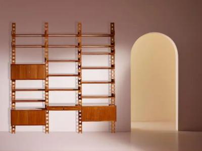 Wall mounted bookcase with wooden uprights and modules Italy 1950s