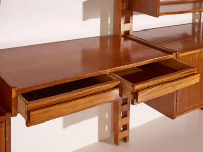 Wall mounted bookcase with wooden uprights and modules Italy 1950s