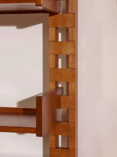 Wall mounted bookcase with wooden uprights and modules Italy 1950s