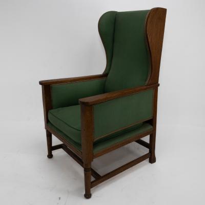 Walter Skull High Wycombe An Arts Crafts Oak Wing Back Upholstered Armchair