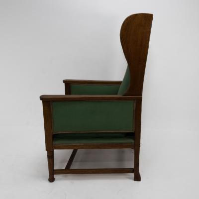 Walter Skull High Wycombe An Arts Crafts Oak Wing Back Upholstered Armchair