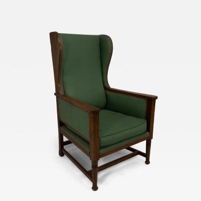 Walter Skull High Wycombe An Arts Crafts Oak Wing Back Upholstered Armchair