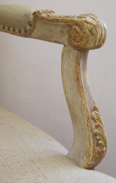 Well Carved French Regence Style Ivory Painted and Parcel gilt Open Arm Chair