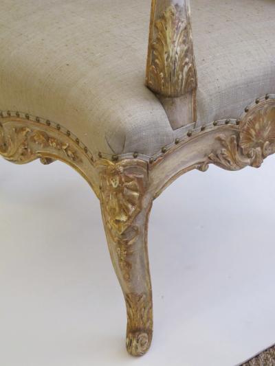 Well Carved French Regence Style Ivory Painted and Parcel gilt Open Arm Chair
