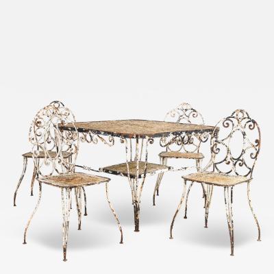 White Scrollwork Garden Dining Table and Four Chairs France 1940s