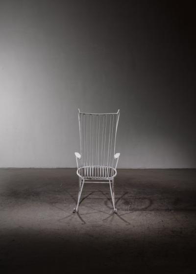 White lacquered wrought iron rocking chair