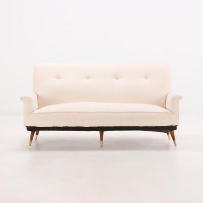 White upholstered Italian three leg sofa circa 1950 having new fabric 