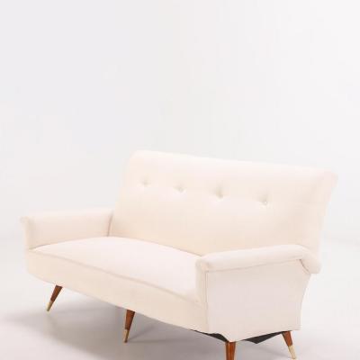 White upholstered Italian three leg sofa circa 1950 having new fabric 