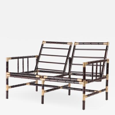 William Billy Haines A brass mounted faux bamboo adjustable settee In the manner of Billy Haines