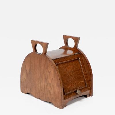 William James Neatby W J Neatby attri An Arts Crafts oak coal box with stylized carrying handles