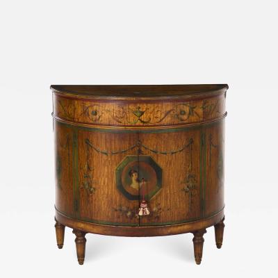 William Wholey A Finely Painted Adams Style Demilune Cabinet by William F Wholey
