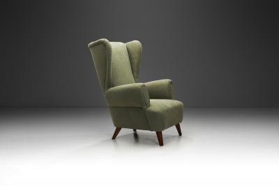 Wingback Armchair Upholstered in Dark Green Europe Mid 20th Century