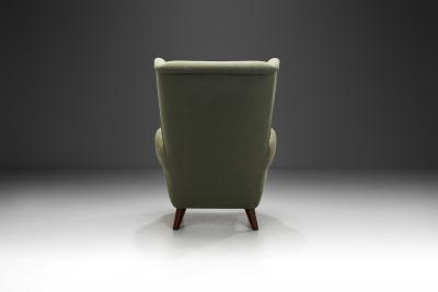 Wingback Armchair Upholstered in Dark Green Europe Mid 20th Century
