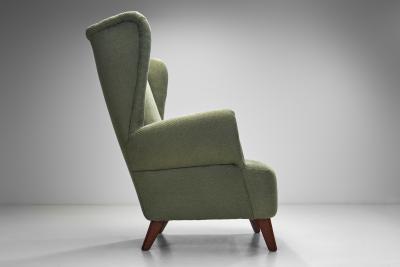 Wingback Armchair Upholstered in Dark Green Europe Mid 20th Century